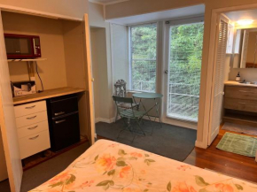 Studio is 2nd door past carport